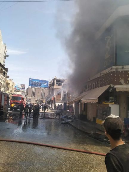 أخماد حريق بمحل ملابس وأحذية رياضية بشارع 23 يوليو بأسيوط دون أصابات